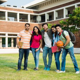 Education is fun - Cheerful Indian asian young students enjoying togetherness in college campus