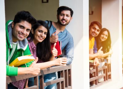 Education is fun - Cheerful Indian asian young students enjoying togetherness in college campus
