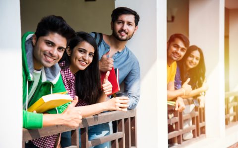 Education is fun - Cheerful Indian asian young students enjoying togetherness in college campus